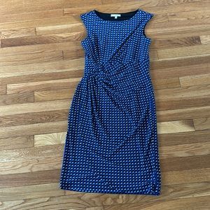 Blue geometric stretchy sleeveless faux-wrap dress.